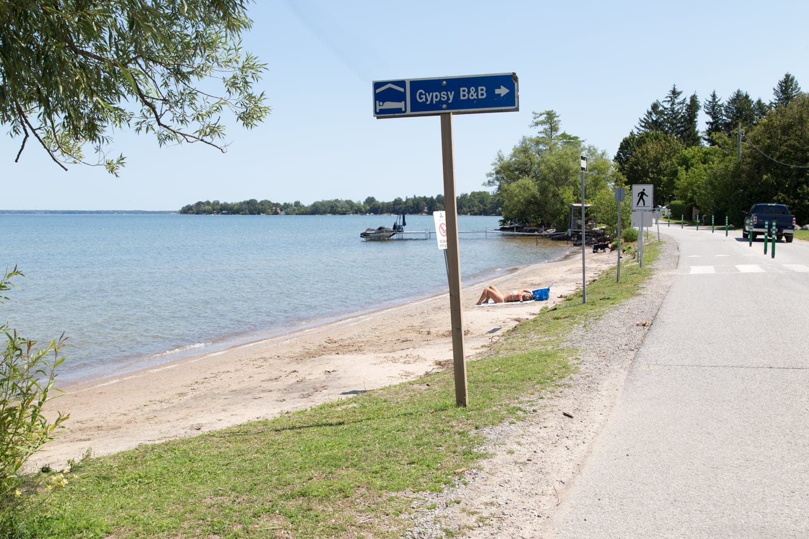 A roadside sign reading "Gypsy B&B" with an arrow, posted at the entrance to Franklin Beach